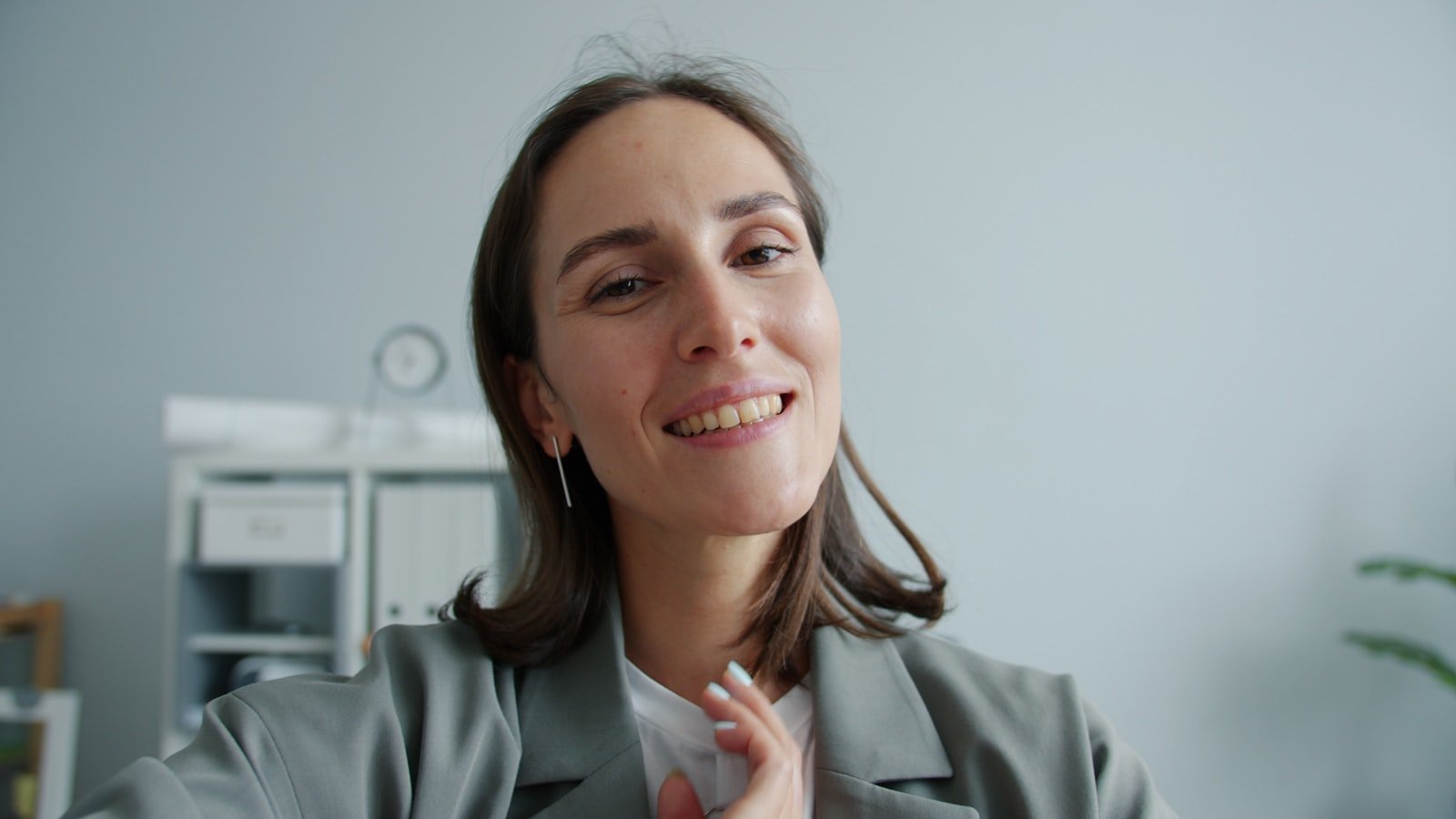 A business coach recording educational content on a laptop