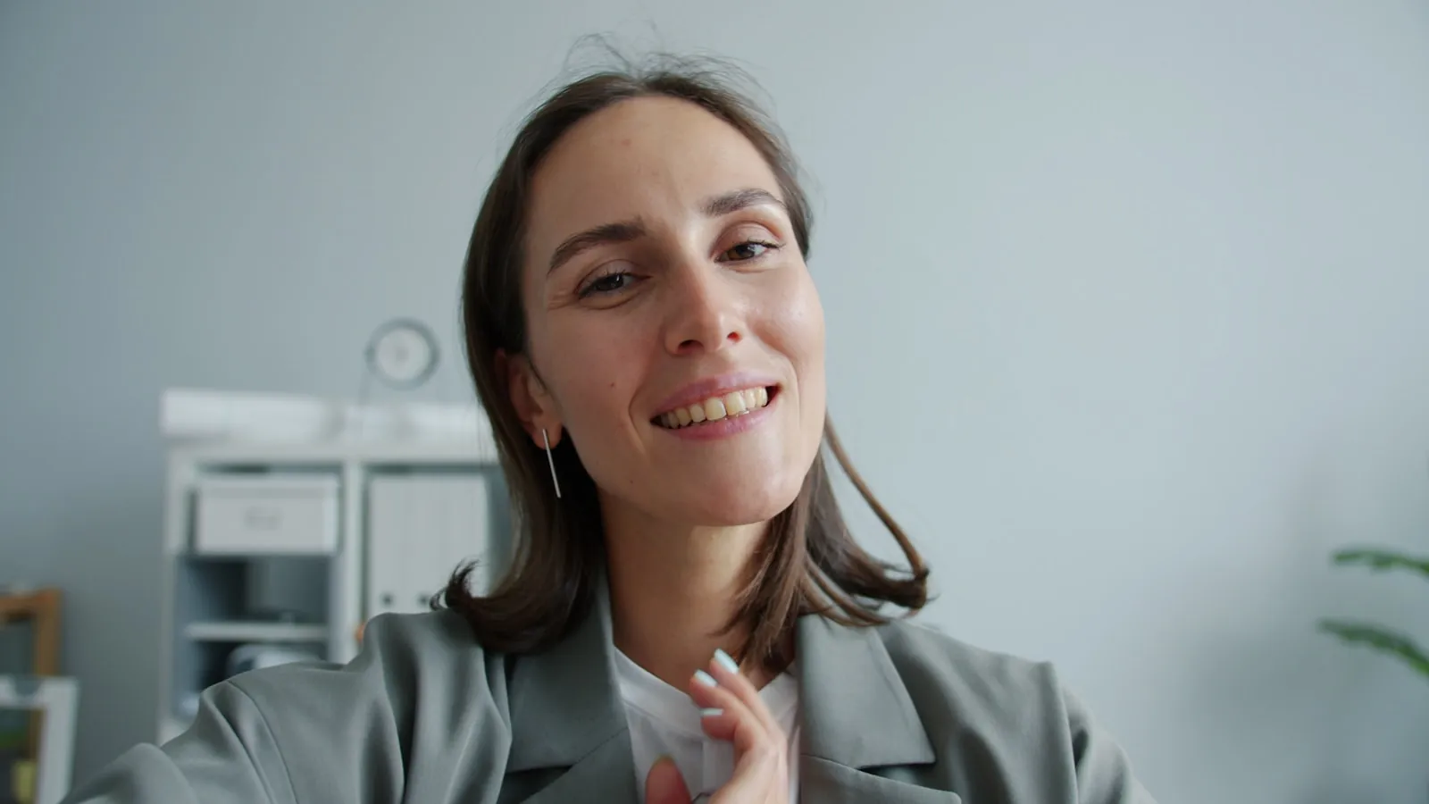 A business coach recording educational content on a laptop