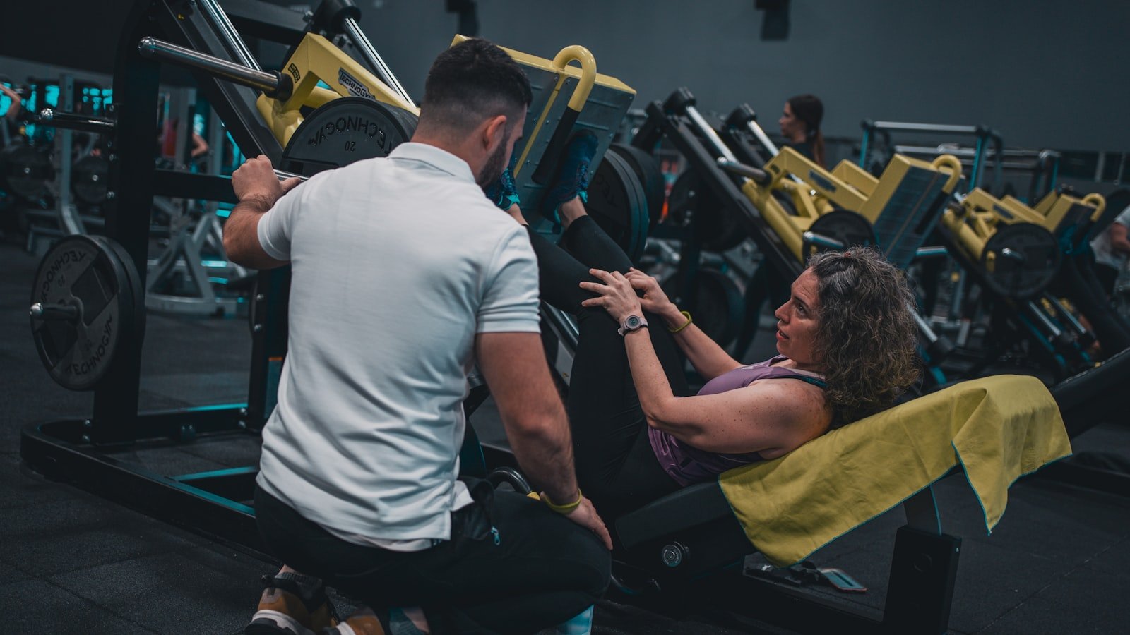 A fitness creator demonstrating a workout in the gym