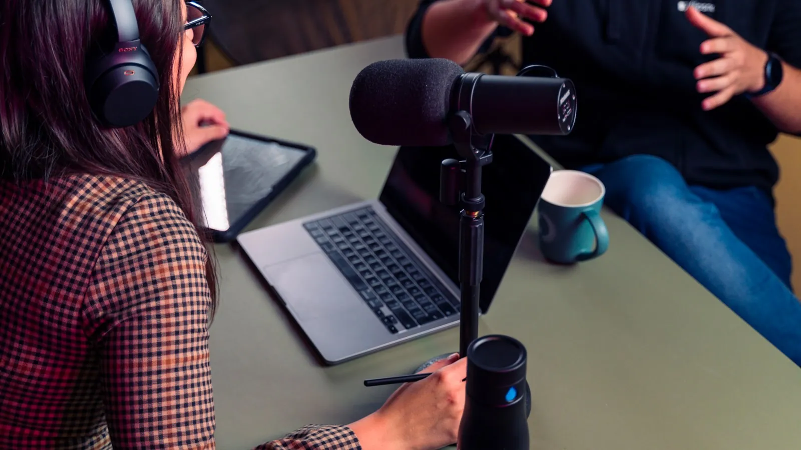 A podcast microphone set up for a recorded conversation