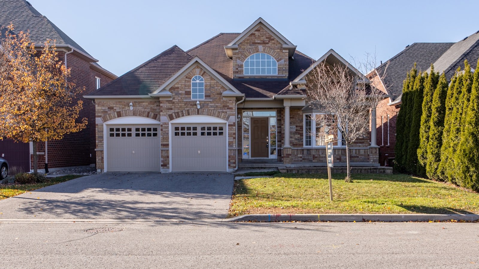 A modern home exterior being photographed for a real estate listing
