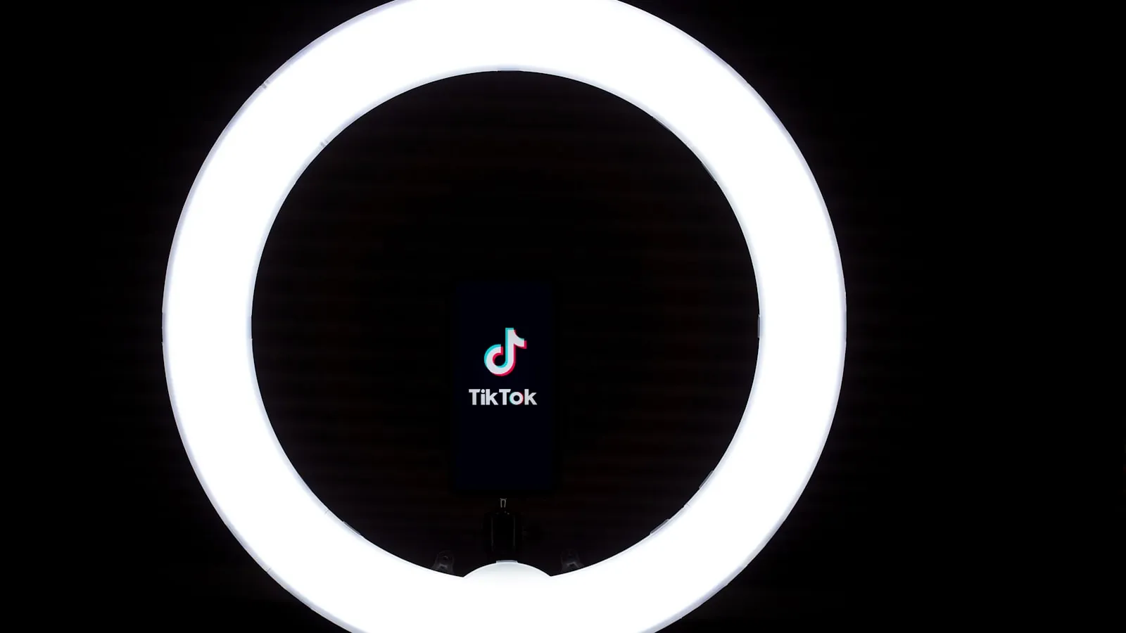 A smartphone set up on a stand for filming vertical video
